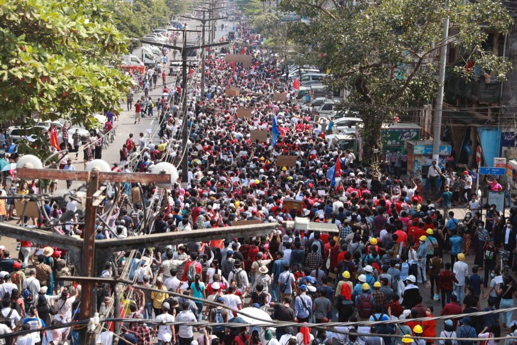  Protesters march towards the direction of Sule Pagoda in Yangon, Myanmar on Sunday, Feb. 7, 2021. Thousands of people rallied against the military takeover in Myanmar’s biggest city on Sunday and demanded the release of Aung San Suu Kyi, whose elected government was toppled by the army that also imposed an internet blackout. (AP Photo) (ASSOCIATED PRESS)