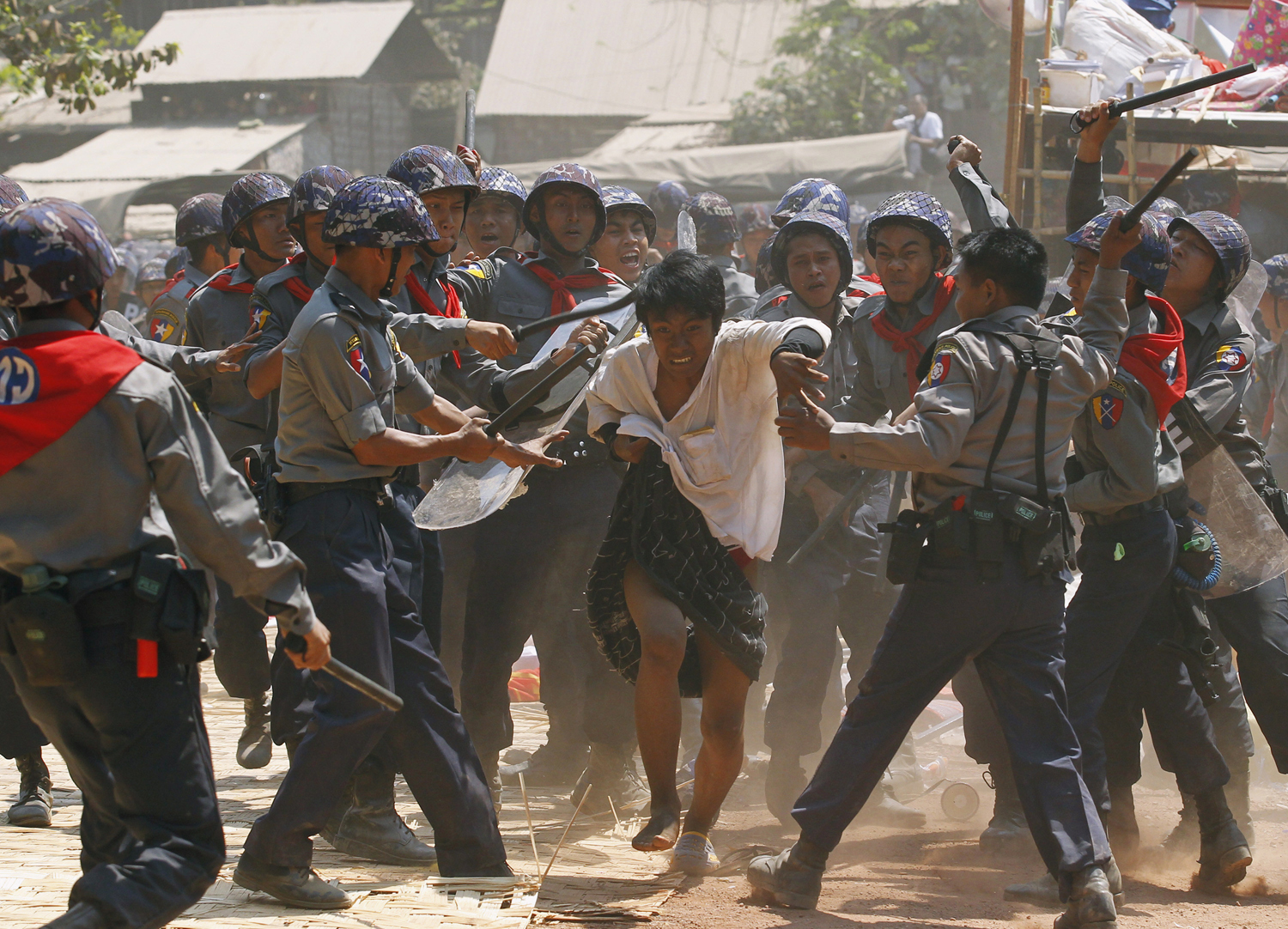 Police assault a student protester in Letpadan, Burma on March 10, 2015. Soe Zeya Tun — Reuters